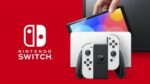 Nintendo Switch (OLED-Modell) mit Dock und weißen Joy-Con-Controllern – Bild 3